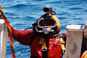 Commercial diver emerging from the water
